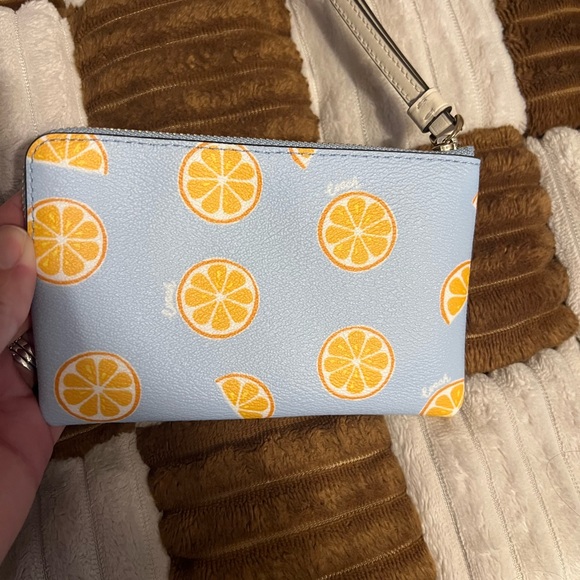 Coach NWOT Signature Coated Canvas Small Corner Zip Wristlet orange print. - Picture 2 of 7